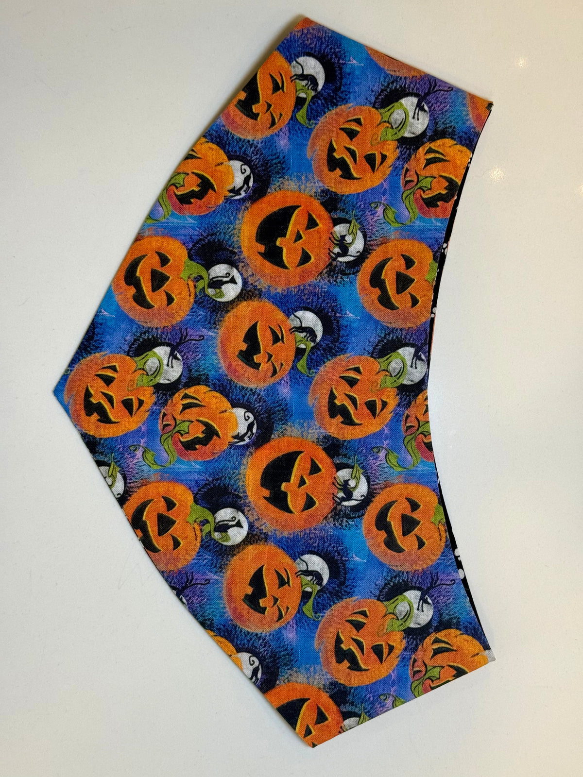 Blue jack-o-lantern side of the Happy Jack reversible pet bandana
