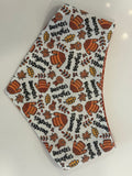 Sweater Weather small print bandana featuring orange sweaters, scarves, autumn leaves and black lettering on cream